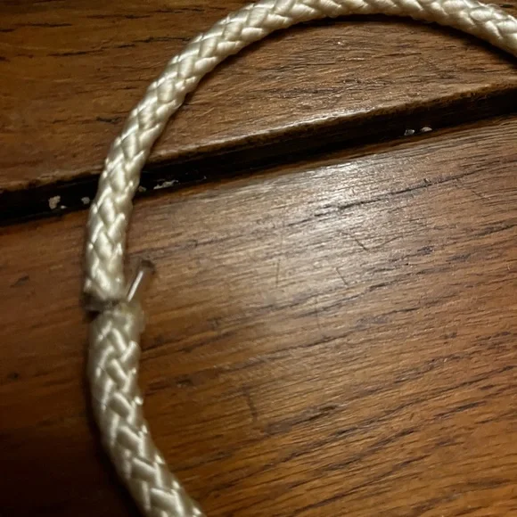 Choker with a white rope and gold dangling heart with gold hardware. - Picture 4 of 4